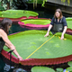 Team members measuring a specimen of V. boliviana at Kew Gardens.